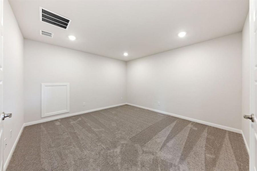 The spacious media room paired with adjacent game room creates the ultimate family entertainment zone.