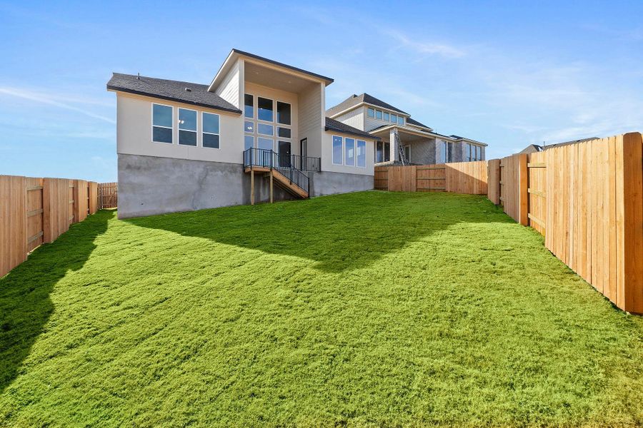 Exterior details and patio area of a home in Lariat, Liberty Hill (Image 25).