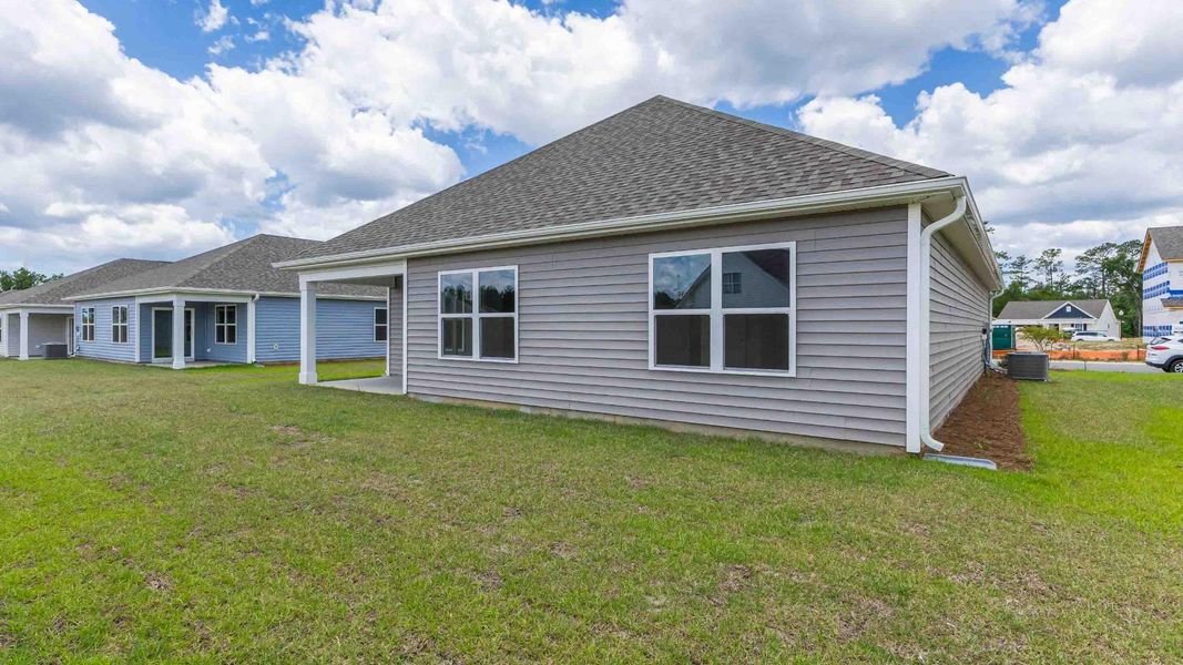 Front exterior of a new home in Vineyard Trail, Jacksonville, NC, highlighting curb appeal (Image 17). Front exterior of a new home in Vineyard Trail, Jacksonville, NC, highlighting curb appeal (Image 17).