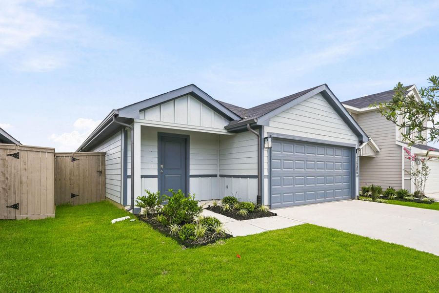 Front exterior of a new home in The Canopies, Splendora, TX, highlighting curb appeal (Image 2). Front exterior of a new home in The Canopies, Splendora, TX, highlighting curb appeal (Image 2).