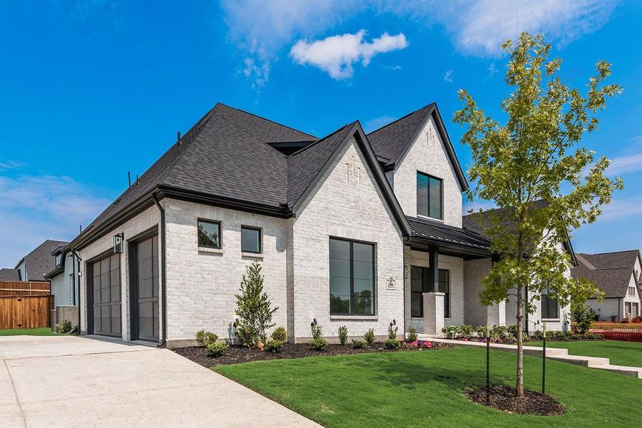 Front exterior of a new home in Winding Creek, Rockwall, TX, highlighting curb appeal (Image 2). Front exterior of a new home in Winding Creek, Rockwall, TX, highlighting curb appeal (Image 2).