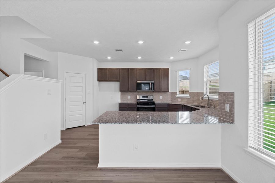 Furnished interior view inside a new home in Oakwood Trails, Tomball (Image 10).