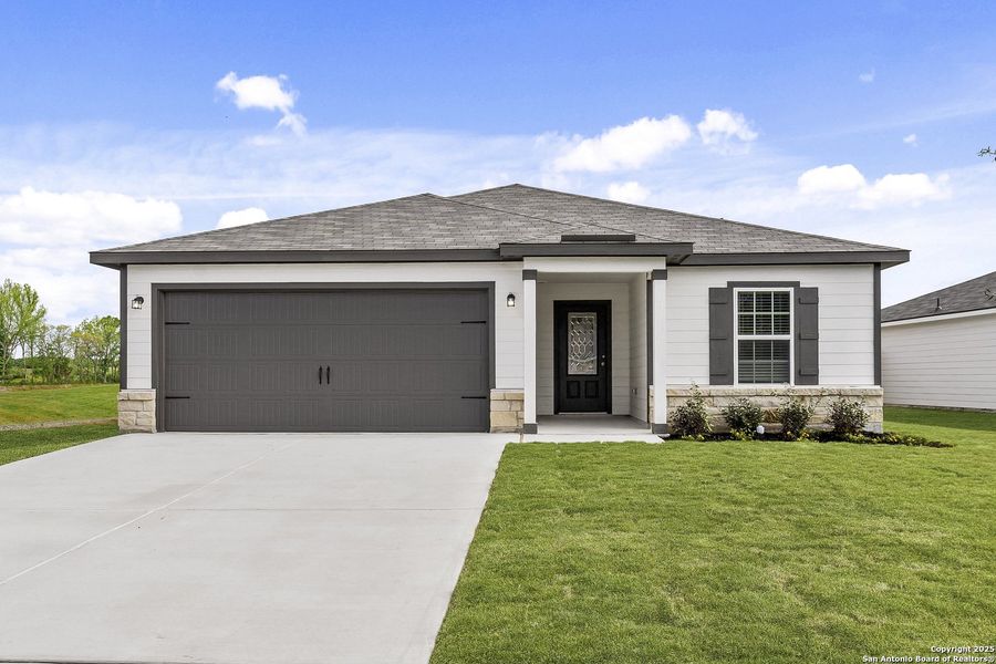 Front exterior of a new home in Rosewood Estates, Lytle, TX, highlighting curb appeal (Image 1).