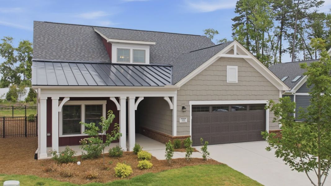 Front exterior of a new home in The Courtyards at Oak Grove, Durham, NC, highlighting curb appeal (Image 22).