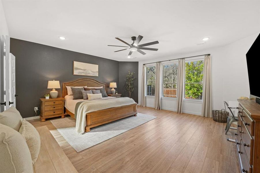 Bedroom featuring light wood-style floors, recessed lighting, and a ceiling fan