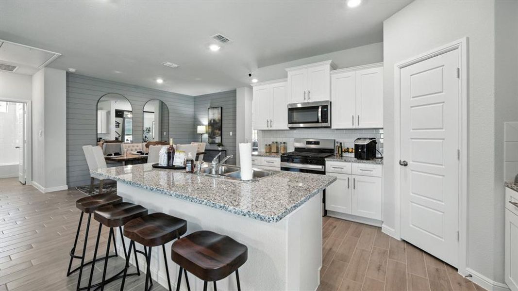 Kitchen-All Home and community information, including pricing, included features, terms, availability and amenities, are subject to change at any time without notice or obligation. All Drawings, pictures, photographs, video, square footages, floor plans, elevations, features, colors and sizes are approximate for illustration purposes only and will vary from the homes as built.