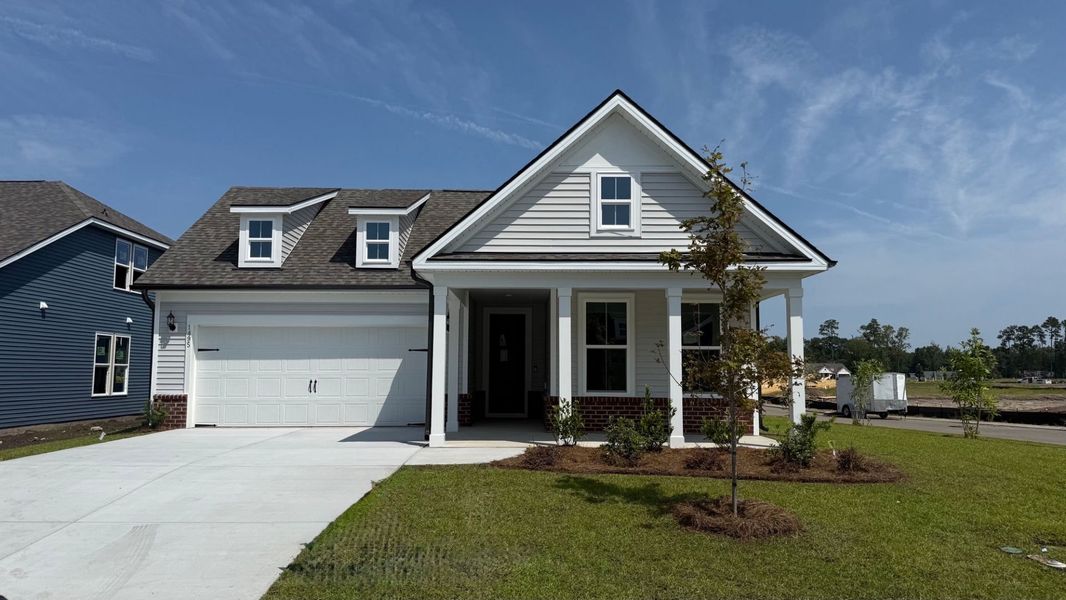 Front exterior of a new home in Crescent Cove, Myrtle Beach, SC, highlighting curb appeal (Image 20).