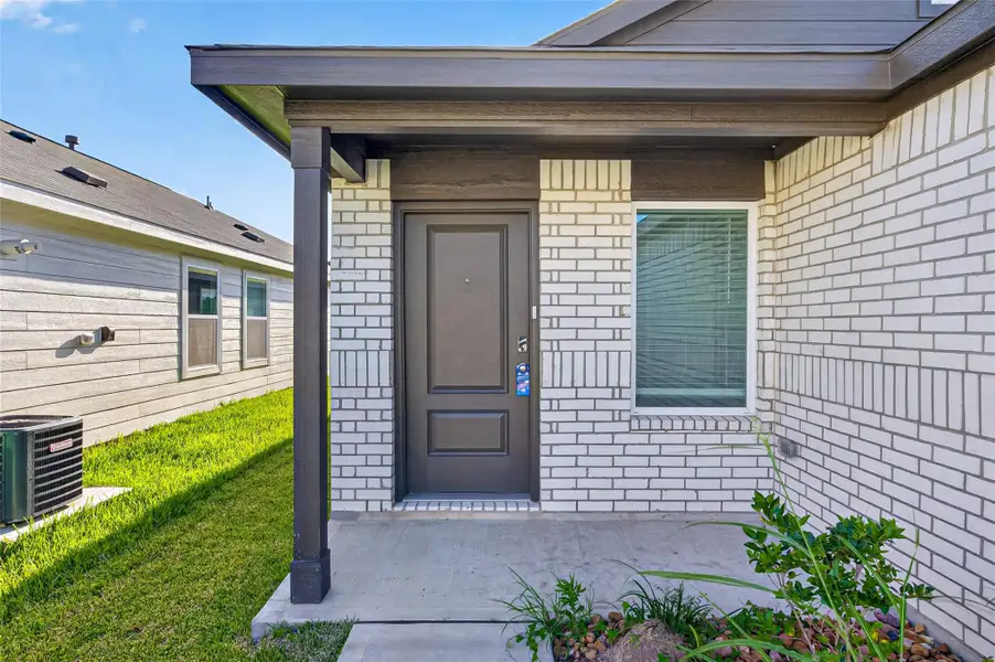Exterior details and patio area of a home in , Houston (Image 3).