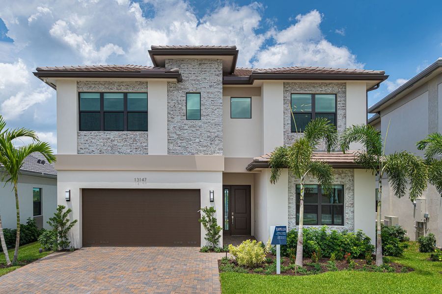Representative exterior photo of a completed home built from the Capella by GL Homes in Apex at Avenir, Palm Beach Gardens, FL (Image 15). Representative exterior photo of a completed home built from the Capella by GL Homes in Apex at Avenir, Palm Beach Gardens, FL (Image 15).