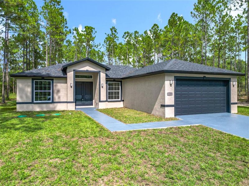Front exterior of a new home in , Citrus Springs, FL, highlighting curb appeal (Image 19).
