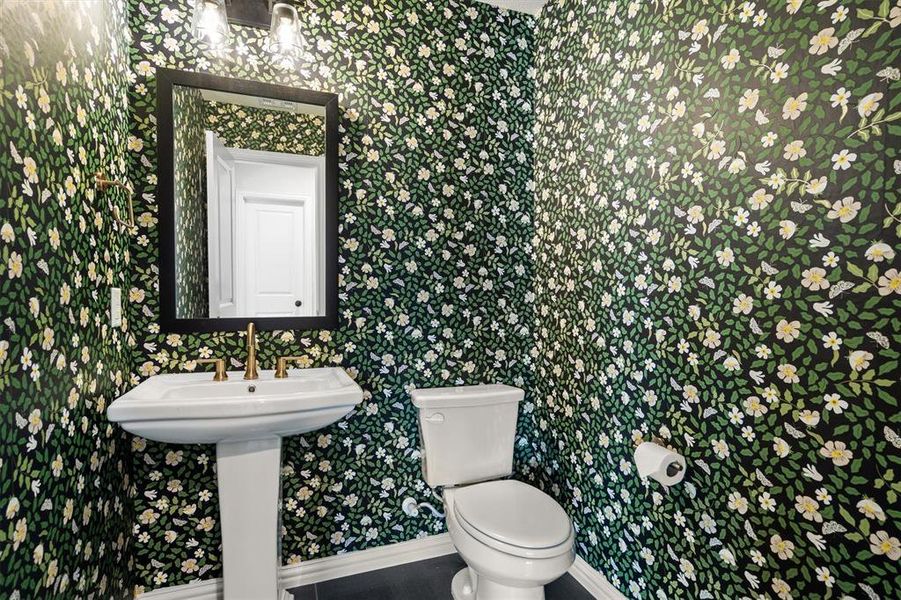 Upstairs powder bath for the guests enjoying the game room or media room.