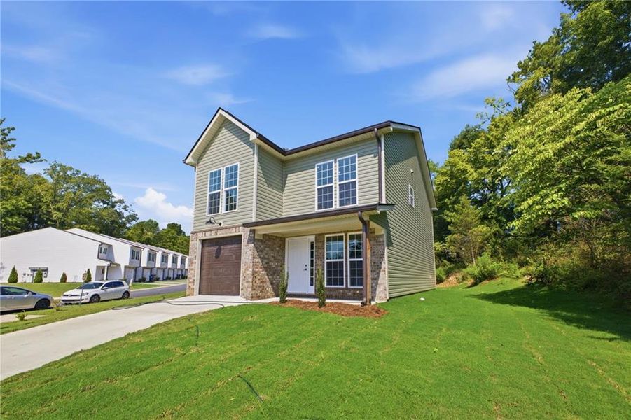 Front exterior of a new home in , Calhoun, GA, highlighting curb appeal (Image 26). Front exterior of a new home in , Calhoun, GA, highlighting curb appeal (Image 26).