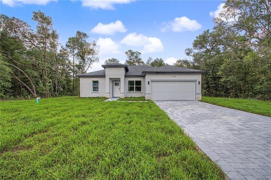 Front exterior of a new home in , Citrus Springs, FL, highlighting curb appeal (Image 19). Front exterior of a new home in , Citrus Springs, FL, highlighting curb appeal (Image 19).