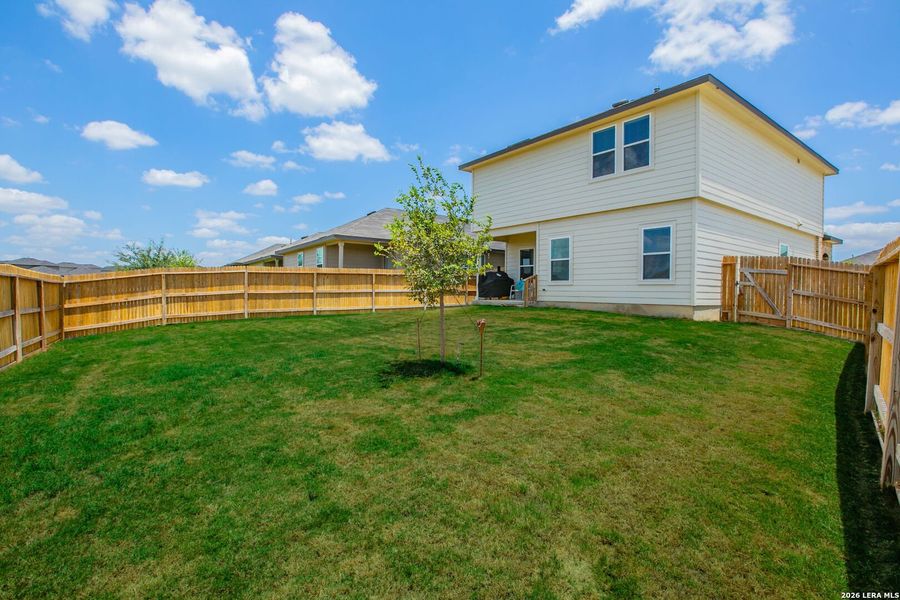 Exterior details and patio area of a home in The Links at River Bend, Floresville (Image 3).