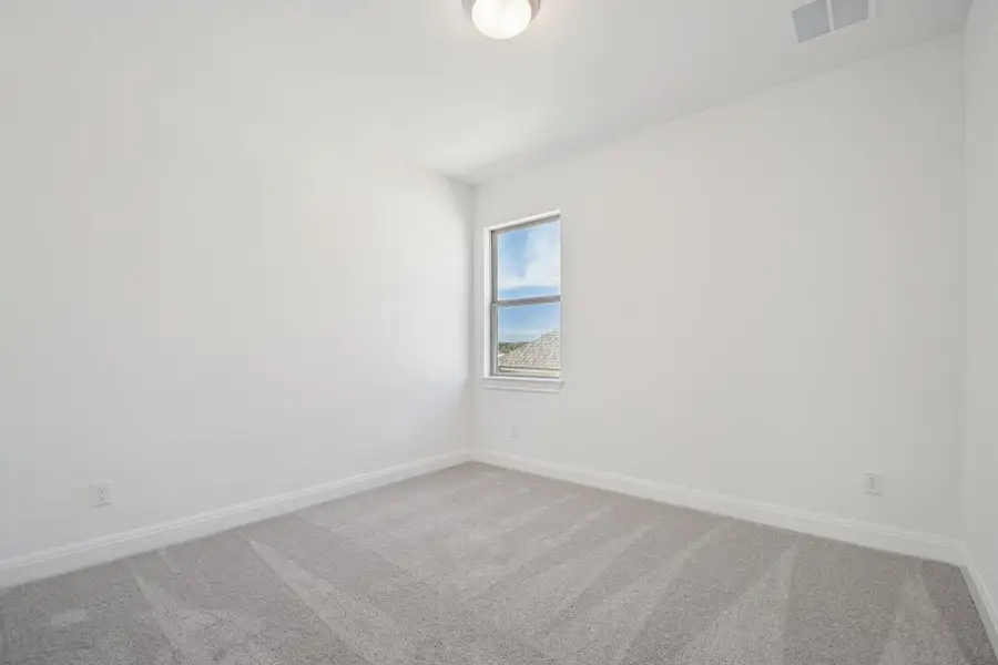 Spacious, unfurnished interior of a new home in 6 Creeks, Kyle (Image 32).