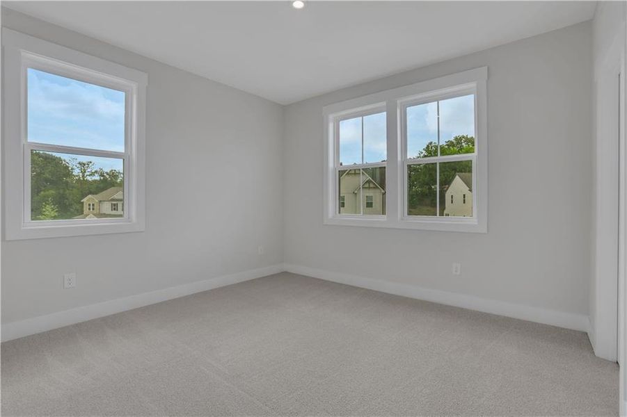 Spacious, unfurnished interior of a new home in The Paddocks at Doc Hughes, Buford (Image 38).