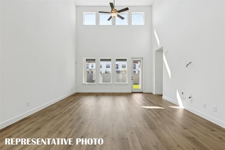 Spacious and flooded with natural light, our Tristan plan offers a family room that can host the entire family!  REPRESENTATIVE PHOTO