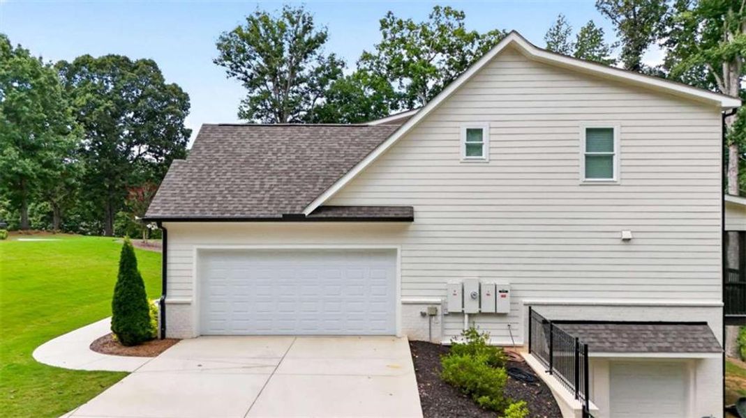 Front exterior of a new home in , Hoschton, GA, highlighting curb appeal (Image 29).