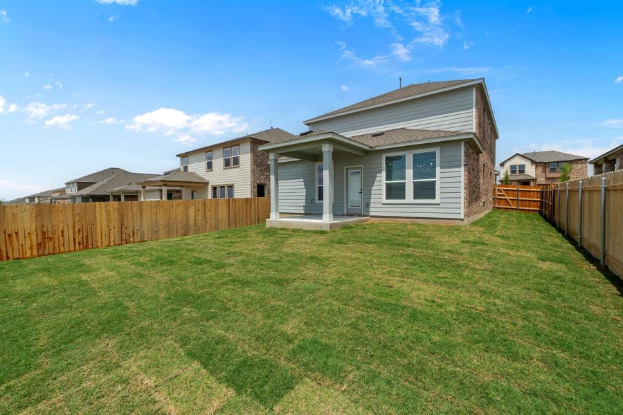 Front exterior of a new home in Salerno - Heritage Collection, Round Rock, TX, highlighting curb appeal (Image 15).
