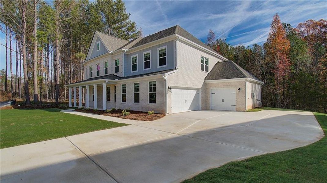 Front exterior of a new home in Trinity Park, McDonough, GA, highlighting curb appeal (Image 2).