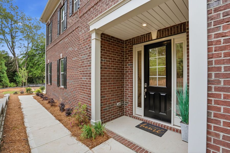 Exterior details and patio area of a home in The Townes at Wade Ardrey, Charlotte (Image 4). Exterior details and patio area of a home in The Townes at Wade Ardrey, Charlotte (Image 4).