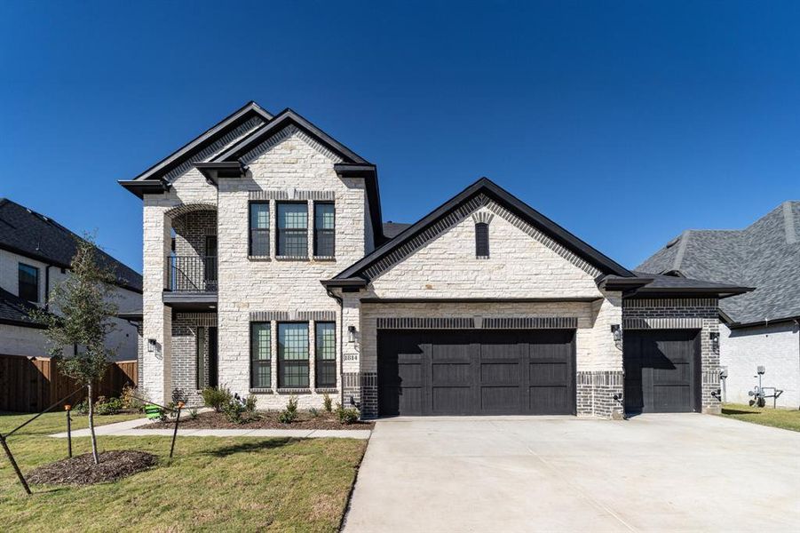 Front exterior of a new home in Sonoma Verde, Rockwall, TX, highlighting curb appeal (Image 1).