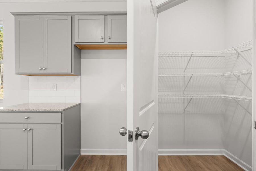 Furnished interior view inside a new home in Northwoods at Mirror Lake, Villa Rica (Image 9).