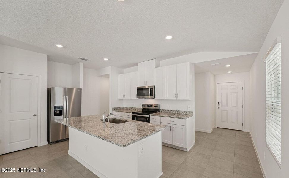 Furnished interior view inside a new home in Flagler Village - Classic Series, Palm Coast (Image 6). Furnished interior view inside a new home in Flagler Village - Classic Series, Palm Coast (Image 6).