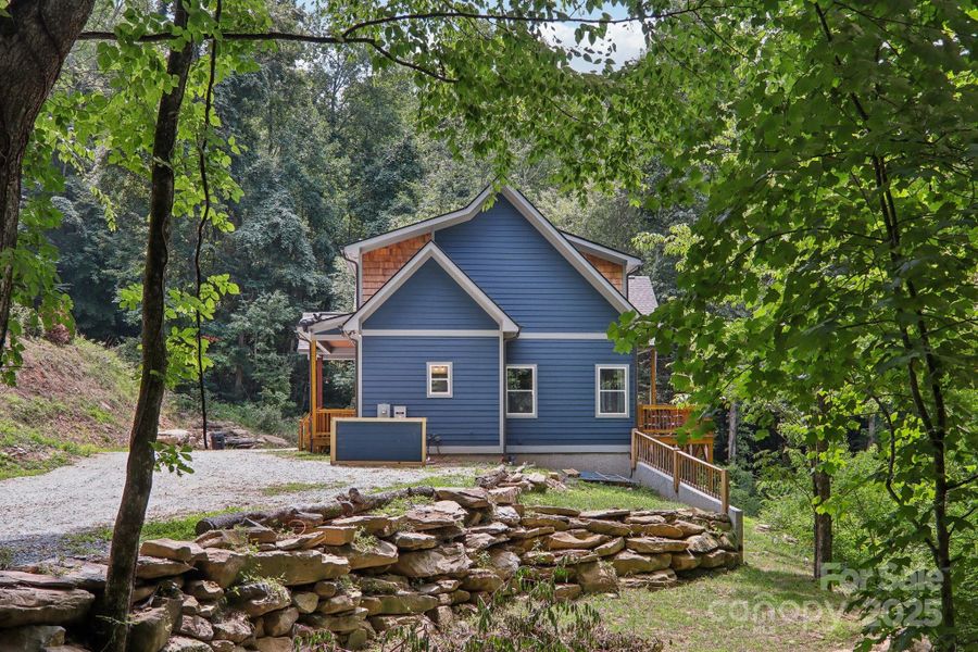 Front exterior of a new home in , Bryson City, NC, highlighting curb appeal (Image 1).