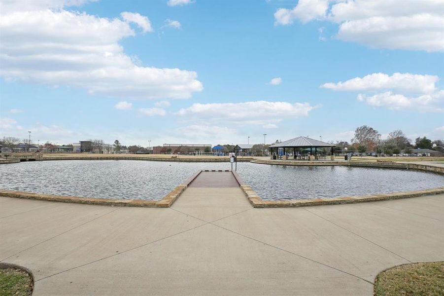 Dock area with a gazebo and a water view