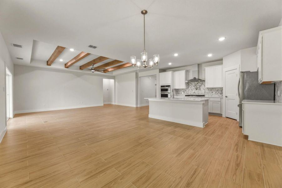 View from dining room looking into kitchen and living.  Nice large space will fit good-sized dining furniture.