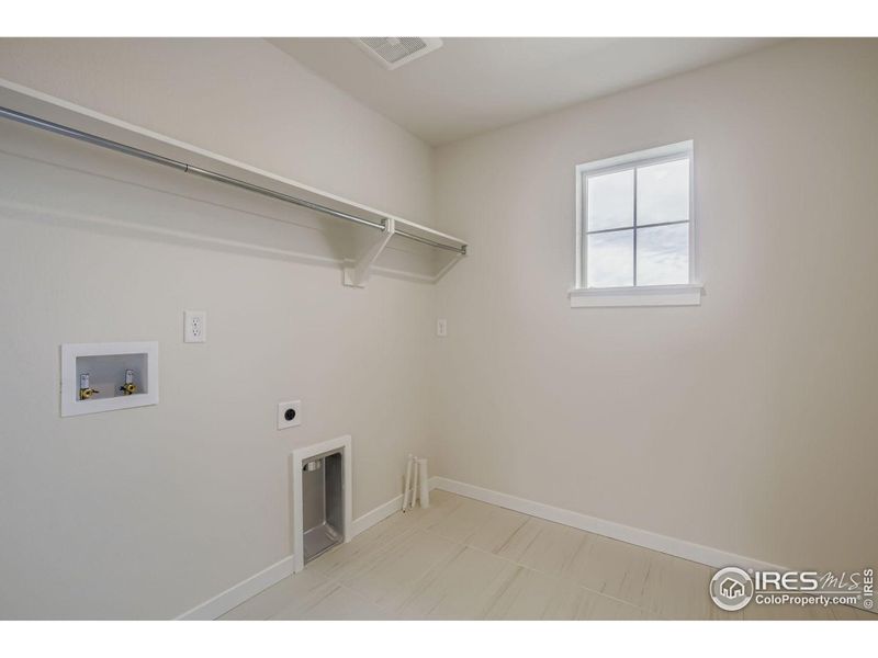 Spacious, unfurnished interior of a new home in RainDance National 60/70, Windsor (Image 25).