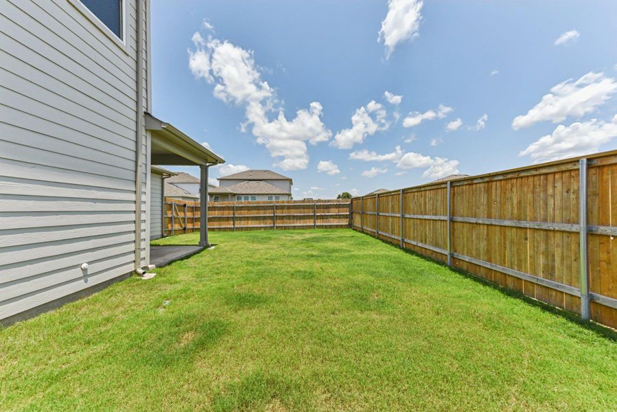 Exterior details and patio area of a home in Stonewall Ranch, Liberty Hill (Image 26).