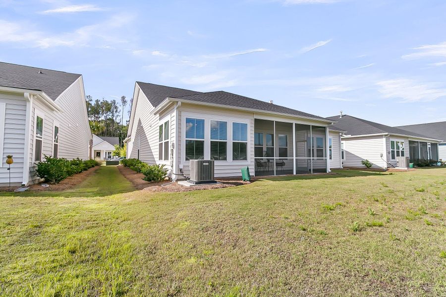 Front exterior of a new home in Horizons at Summers Corner | 55+: The Legends, Summerville, SC, highlighting curb appeal (Image 22).