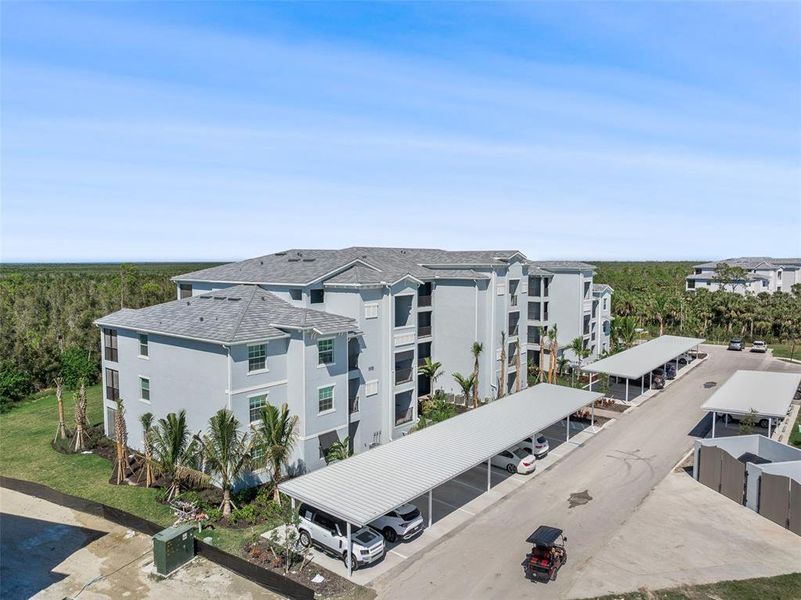 Front exterior of a new home in Heritage Landing: Veranda Condominiums, Punta Gorda, FL, highlighting curb appeal (Image 28).