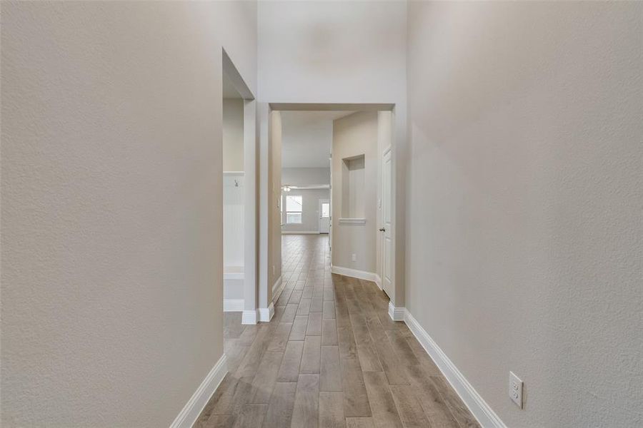 Hallway featuring light wood-type flooring