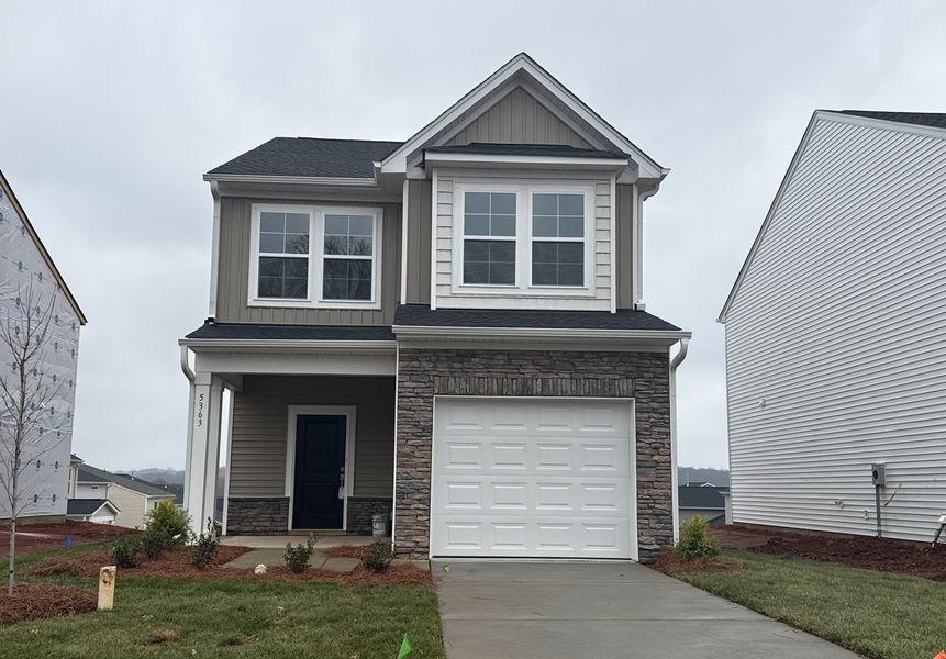 Front exterior of a new home in Hanes Lake, Winston-Salem, NC, highlighting curb appeal (Image 1). Front exterior of a new home in Hanes Lake, Winston-Salem, NC, highlighting curb appeal (Image 1).