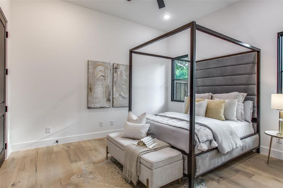 Bedroom with light wood-type flooring and ceiling fan