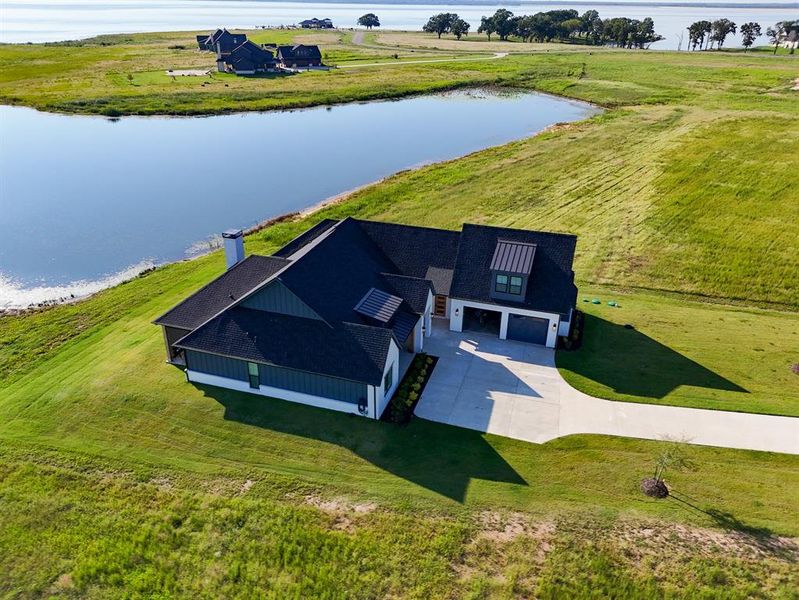 View of subject property featuring a nearby body of water View of subject property featuring a nearby body of water
