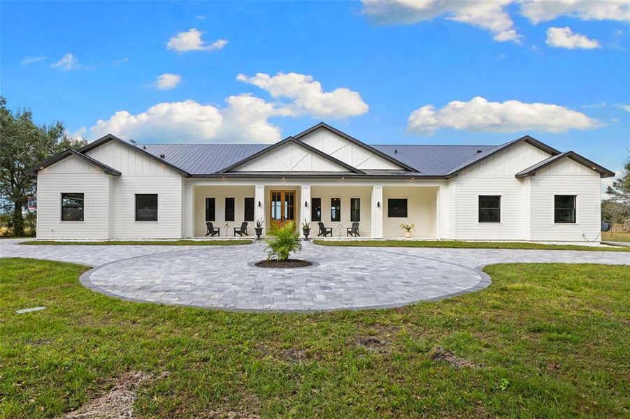 Front exterior of a new home in , Myakka City, FL, highlighting curb appeal (Image 23).