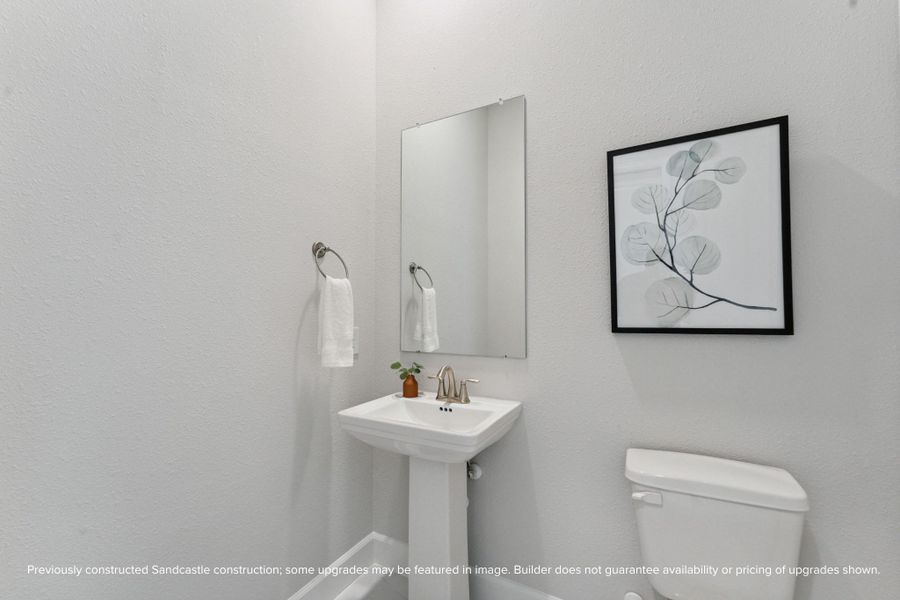 Elegant Powder Room – This half bath features sleek finishes offering both style and functionality for your guests.