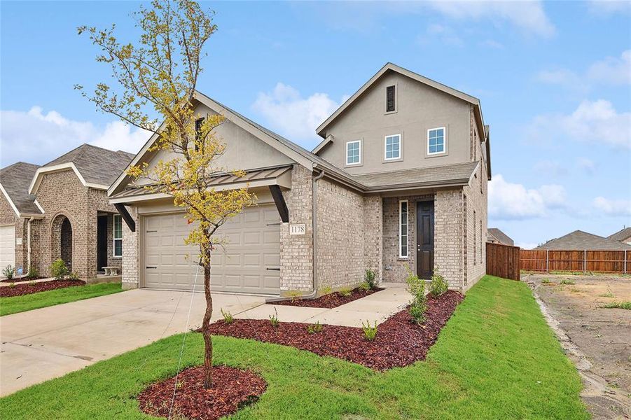 View of front property featuring cooling unit, a front lawn, and a garage