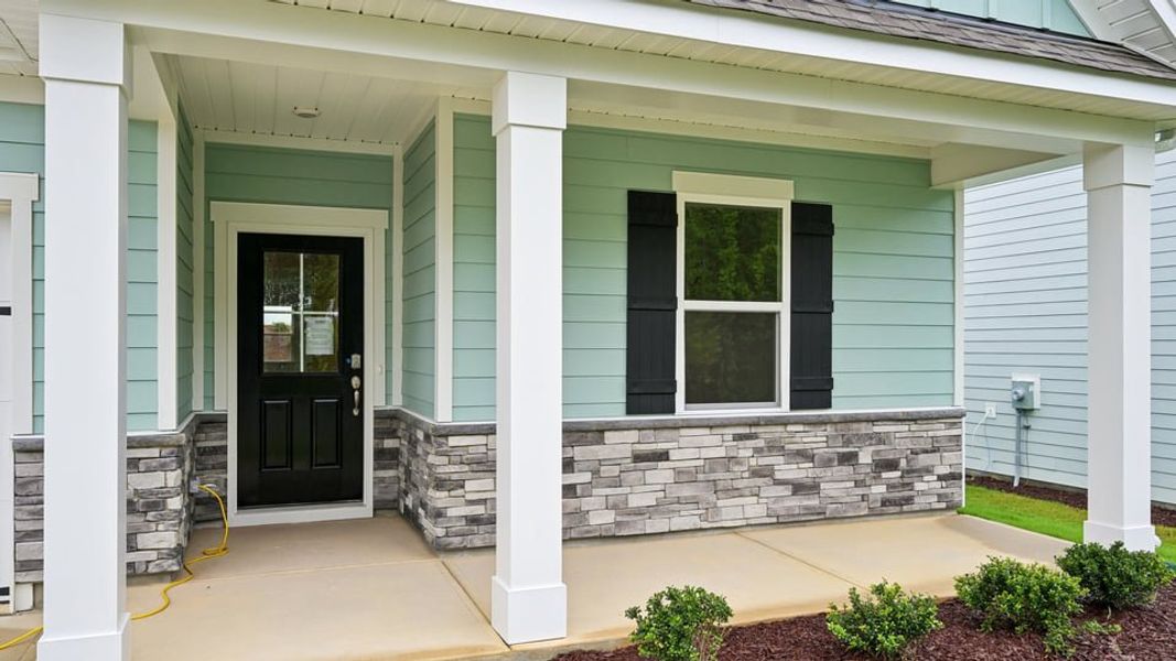 Exterior details and patio area of a home in Bexford, Willow Spring (Image 2). Exterior details and patio area of a home in Bexford, Willow Spring (Image 2).