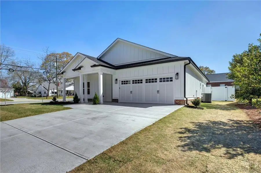Front exterior of a new home in , Covington, GA, highlighting curb appeal (Image 2). Front exterior of a new home in , Covington, GA, highlighting curb appeal (Image 2).