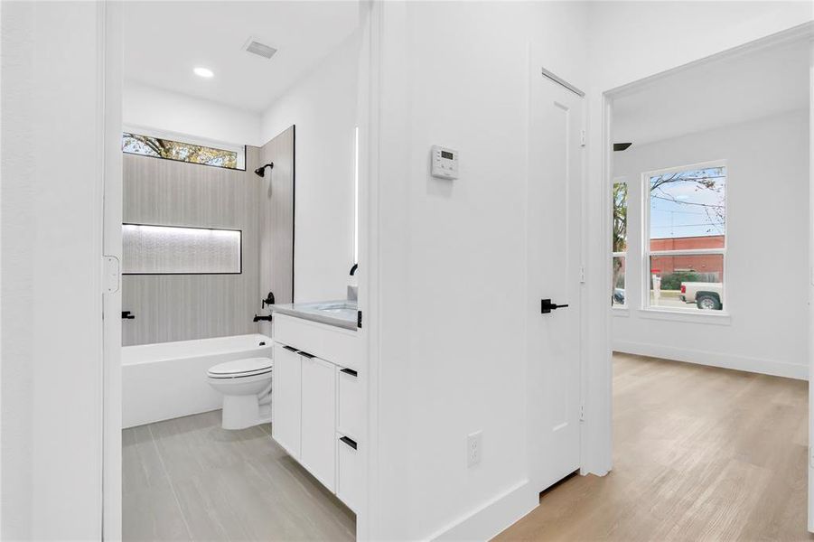 Bathroom with vanity and shower / tub combination