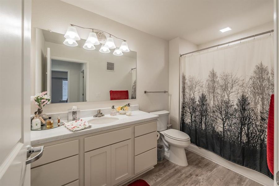 Generous counter top space in spare bathroom, that offers plenty of space for daily essentials.