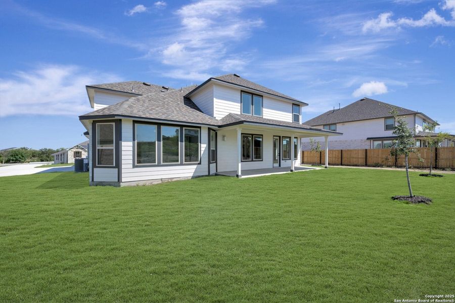 Front exterior of a new home in Everly Estates, San Antonio, TX, highlighting curb appeal (Image 17). Front exterior of a new home in Everly Estates, San Antonio, TX, highlighting curb appeal (Image 17).