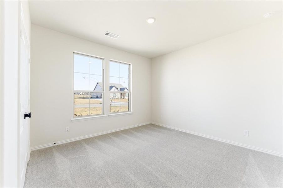 Unfurnished room with light carpet and recessed lighting