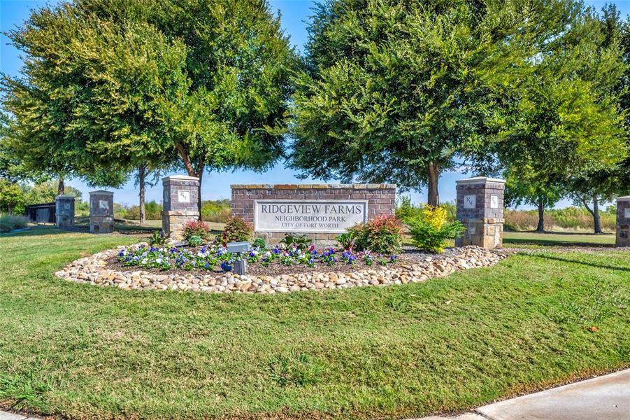 Community entrance and park with playground. Community entrance and park with playground.