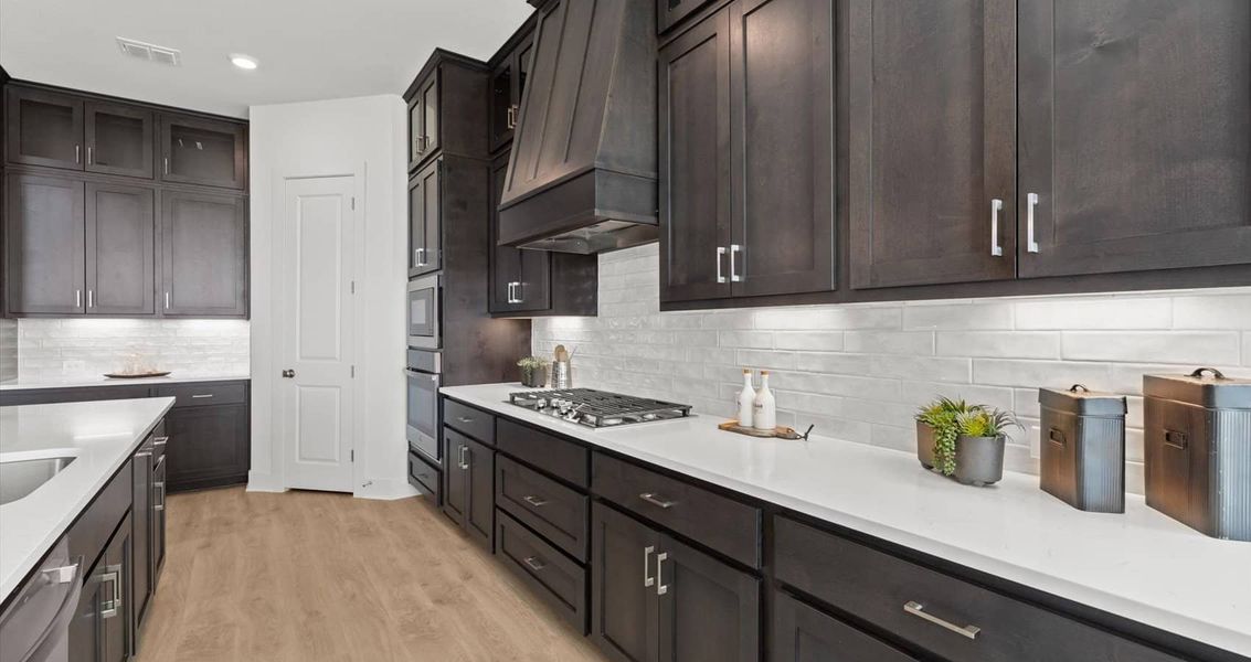 Representative furnished interior of a home built from the Waterloo by Chesmar Homes in Sunfield, Buda (Image 13).
